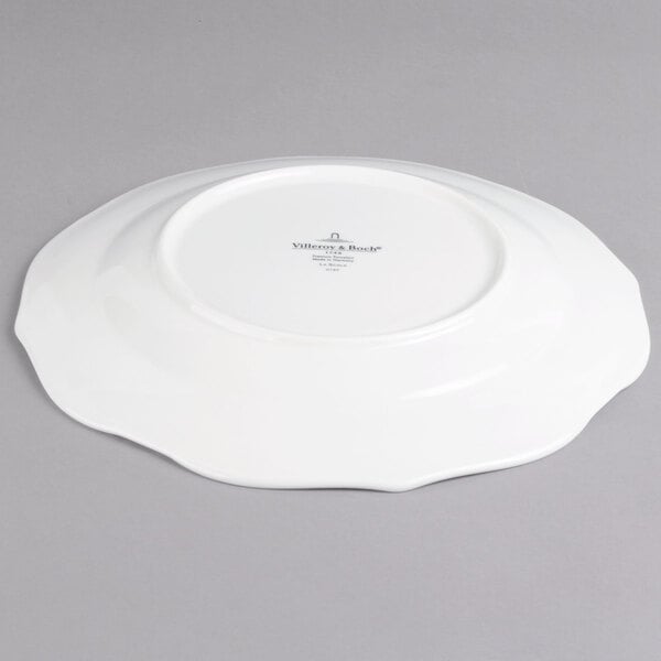 A white Villeroy & Boch porcelain plate with a small design on it.