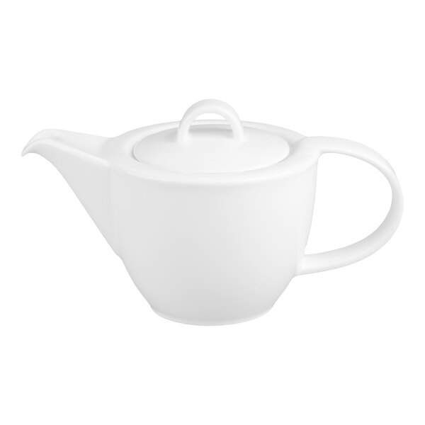 A white porcelain teapot with a rounded body, a curved handle, a spout, and a lid featuring a looped handle.