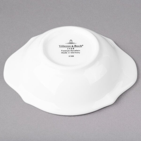 A white Villeroy & Boch oval bowl with black text on it.