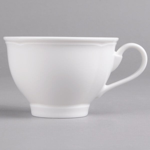 A Villeroy & Boch white porcelain cup with a handle.