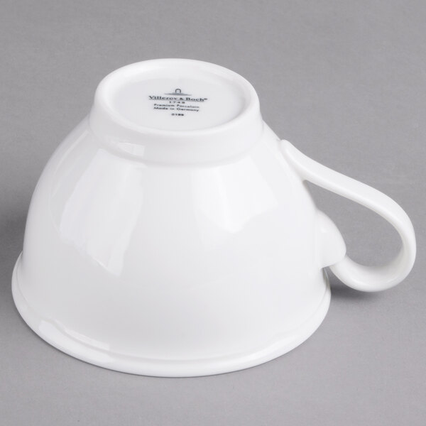 A Villeroy & Boch white porcelain cup with a handle.