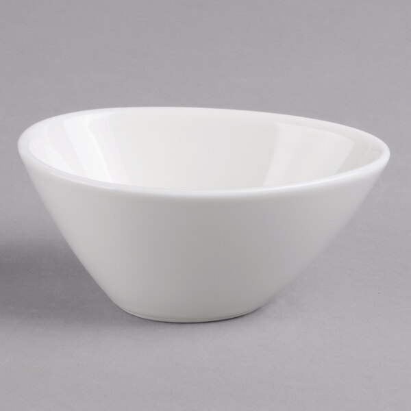 A white Villeroy & Boch porcelain bowl on a gray surface.