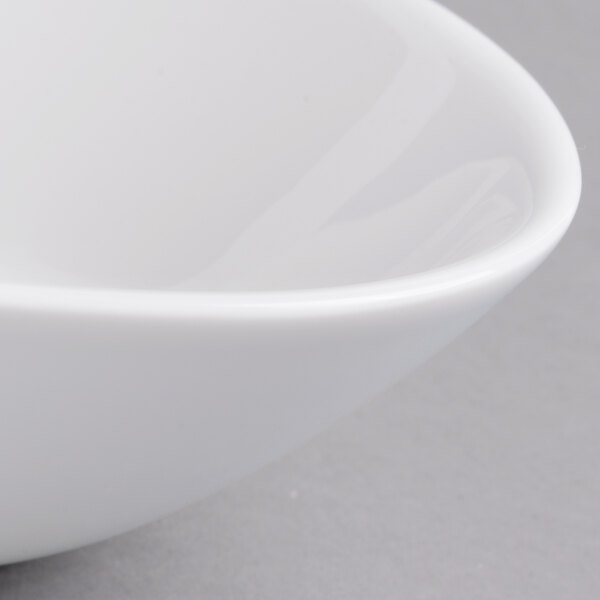 A close-up of a Villeroy & Boch white porcelain oval deep bowl.