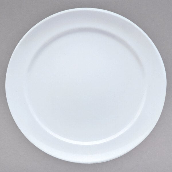 A close-up of a Villeroy & Boch white porcelain plate with a white rim.