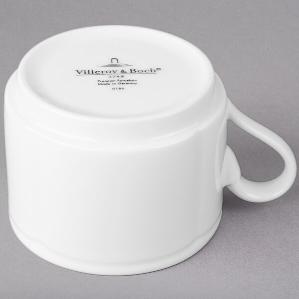 A Villeroy & Boch white porcelain mug with a handle.