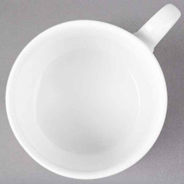 A white Villeroy & Boch porcelain cup with a black handle.