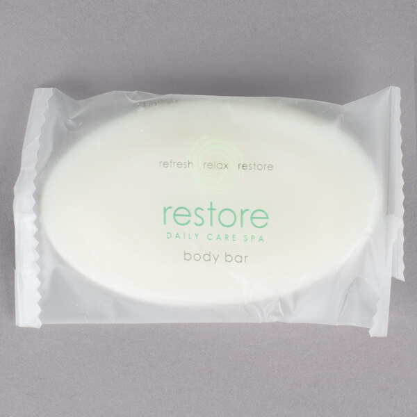 A white Dial Restore Basics body bar in plastic wrap.
