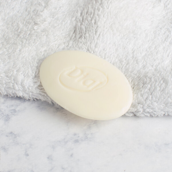 A Dial Restore Basics white body bar on a white towel.