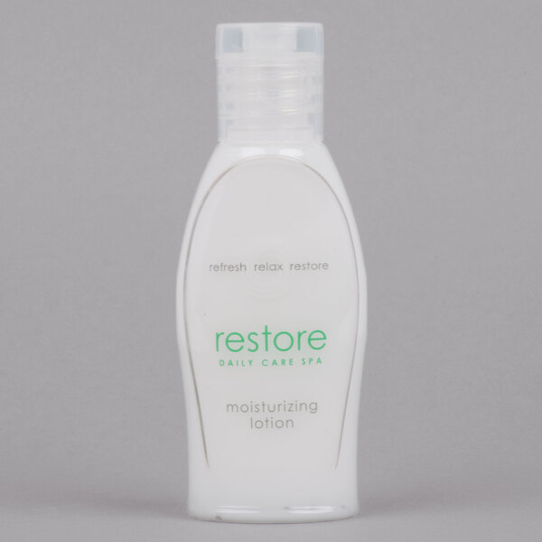 A white bottle of Dial Restore Hand & Body Lotion with green text.