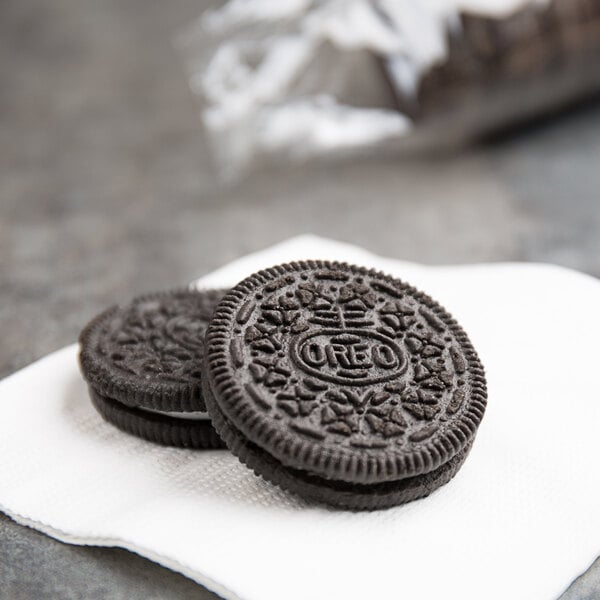 A chocolate Nabisco Oreo cookie on a napkin.