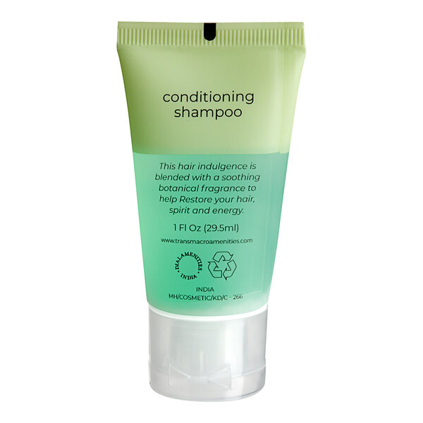 A green and white bottle of Dial Restore Conditioning Shampoo.