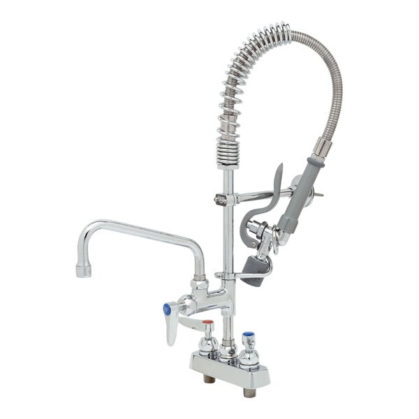 A T&S deck mounted pre-rinse faucet with hose and sprayer.