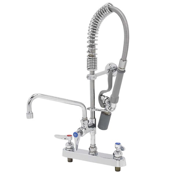 A chrome T&S deck mounted pre-rinse faucet with a silver hose attached.