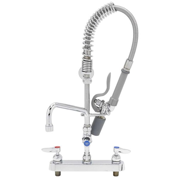 A close-up of a chrome T&S pre-rinse faucet with a hose attached.