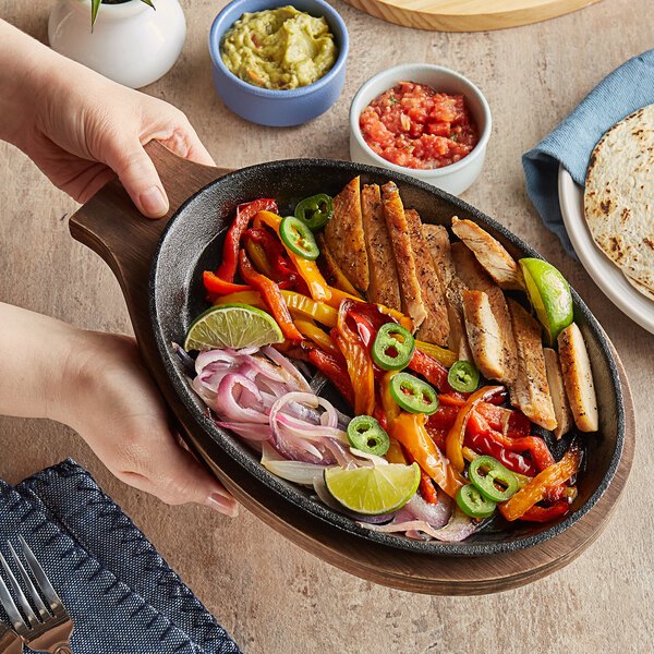 Choice 9 1/4" X 7" Oval Pre-Seasoned Cast Iron Fajita Skillet