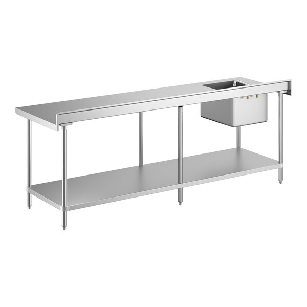 A long stainless steel work table with an integrated sink and faucet on the left side, supported by metal legs and featuring a lower shelf for storage.