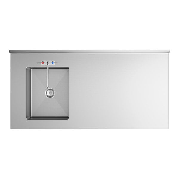 A stainless steel work table with an integrated sink and faucet positioned on the left side.