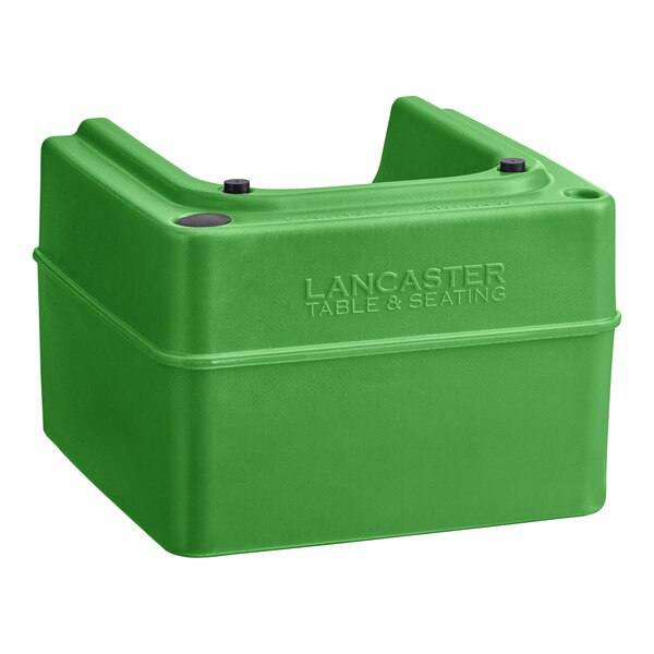 A green plastic Lancaster Table & Seating booster seat.