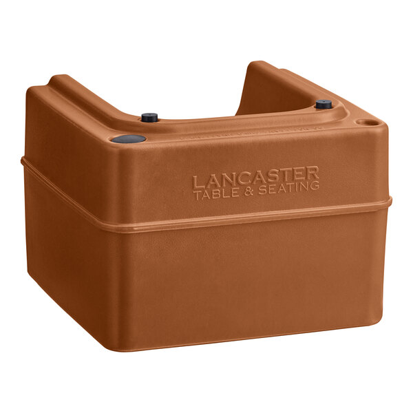 A brown plastic Lancaster Table & Seating booster seat with black screws.
