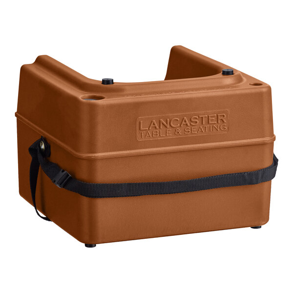 A brown plastic Lancaster Table & Seating booster seat with a black strap.