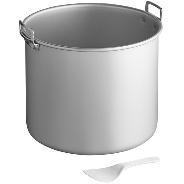 A stainless steel Town rice warmer with a spoon.