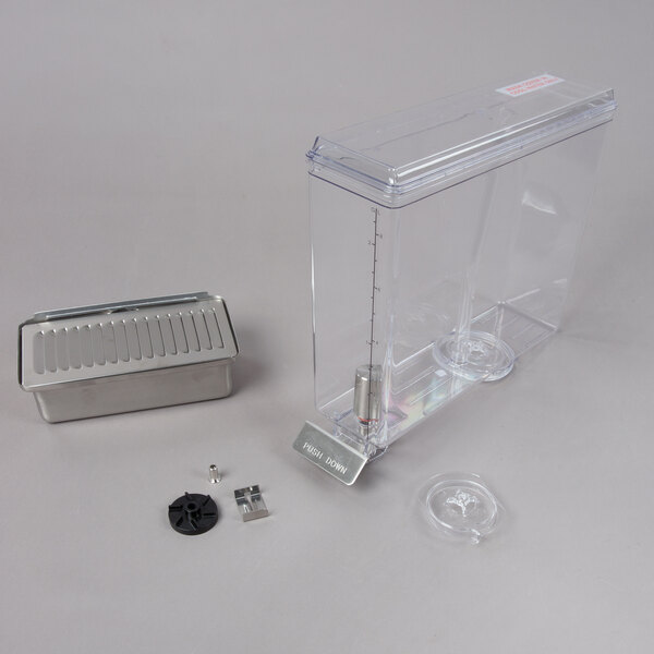 A clear plastic container with a metal drip tray and metal containers.