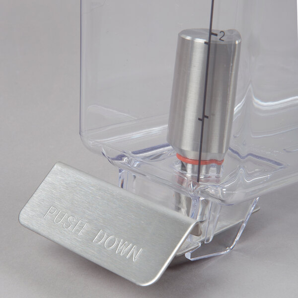 A close-up of a clear plastic container with metal cylinders inside.