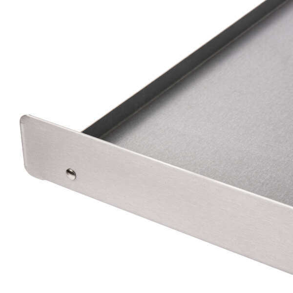 A metal crumb tray for an Avantco countertop pizza oven.
