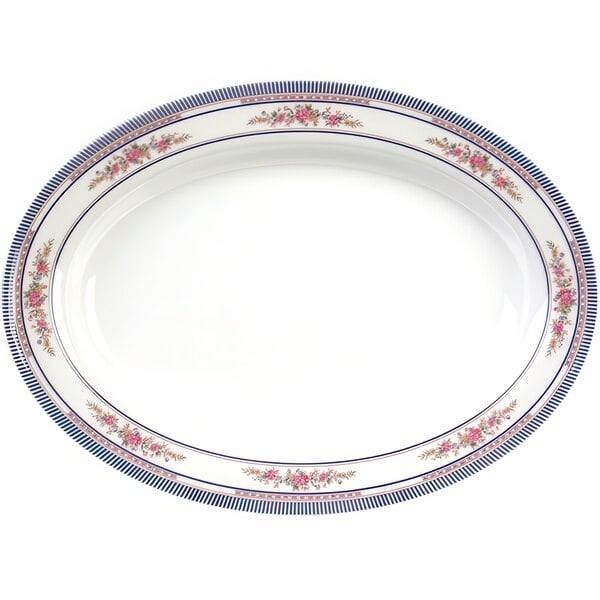 A white oval melamine platter with blue and pink flowers on the edge.