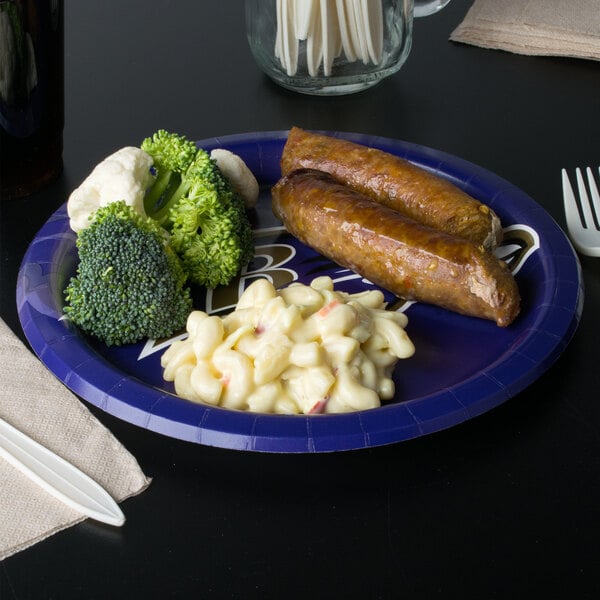 A Creative Converting Baltimore Ravens paper dinner plate with broccoli and cauliflower on it.