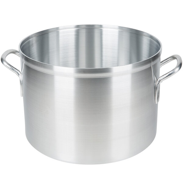 A large silver aluminum sauce pot with two handles.