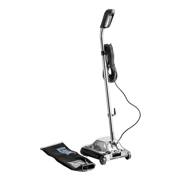 An upright bagged vacuum cleaner with a chrome finish and a detachable black dust bag.