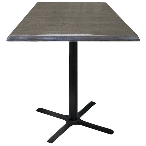 A Holland Bar Stool charcoal table with a square black top on a black cross base.
