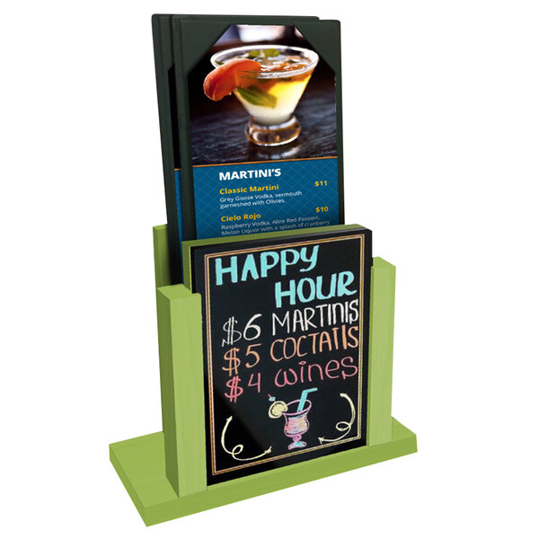 A lime wood menu holder with a wet erase board insert on a counter with a drink.