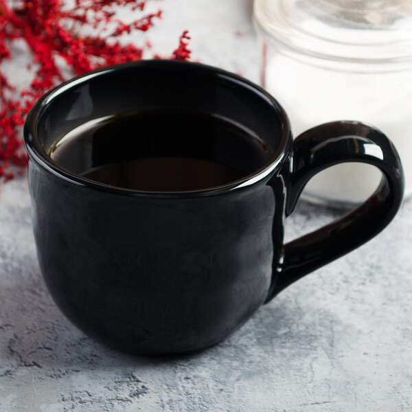 A close-up of a black Reserve by Libbey Pebblebrook mug.