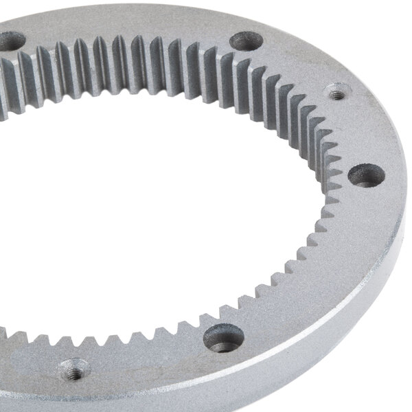 A close-up of the Avantco turning plate gear ring with holes and gears.