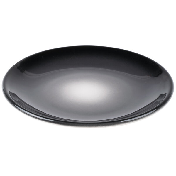 A black Reserve by Libbey Pebblebrook porcelain coupe plate with a white rim.