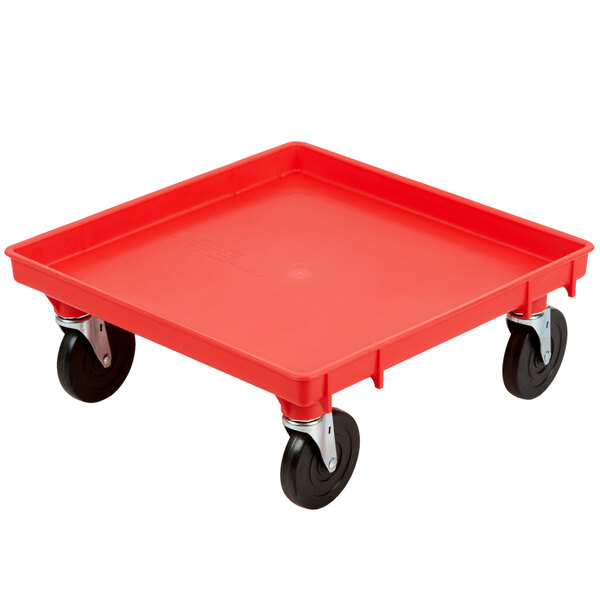A red plastic Vollrath Traex dolly base with black wheels.