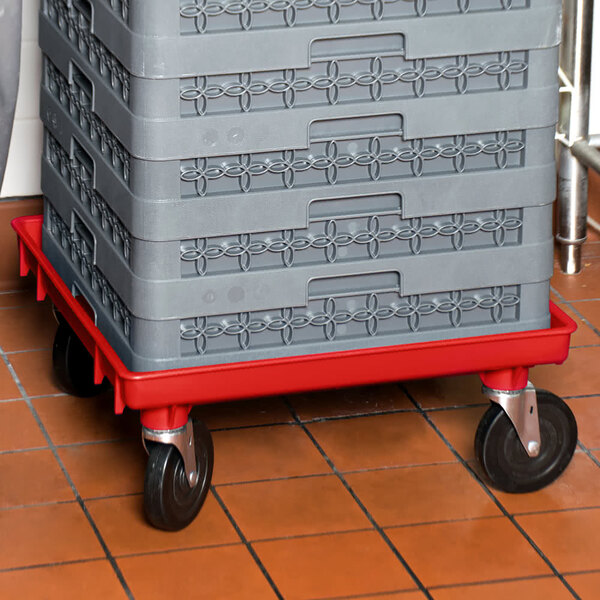 A grey plastic dolly base with red accents.