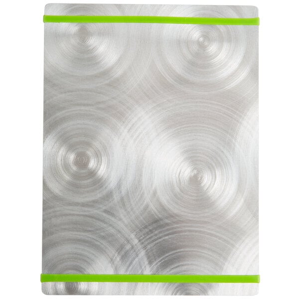 A silver Alumitique menu board with green swirls on a metal surface.