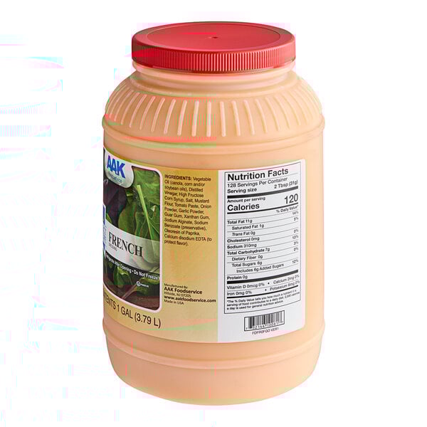 A plastic container of AAK Select Recipe French Dressing with a red lid.