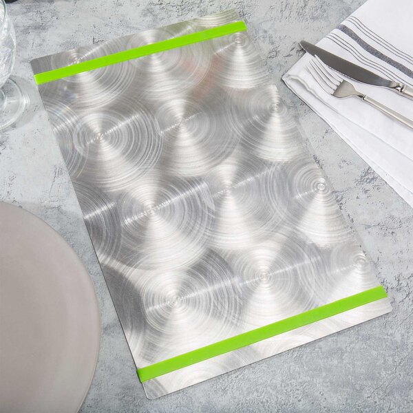 A Menu Solutions Alumitique menu board with a green band on a white surface with silverware.