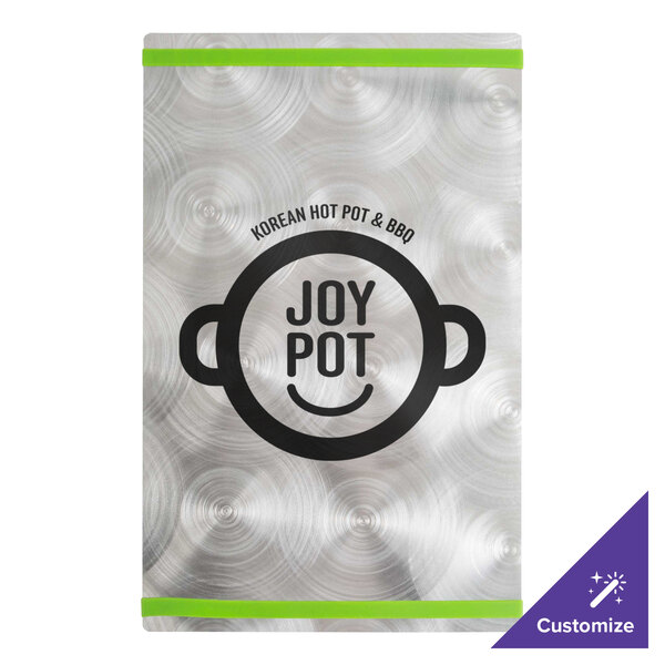 A silver Alumitique menu board with green bands and a restaurant logo on a metal surface.