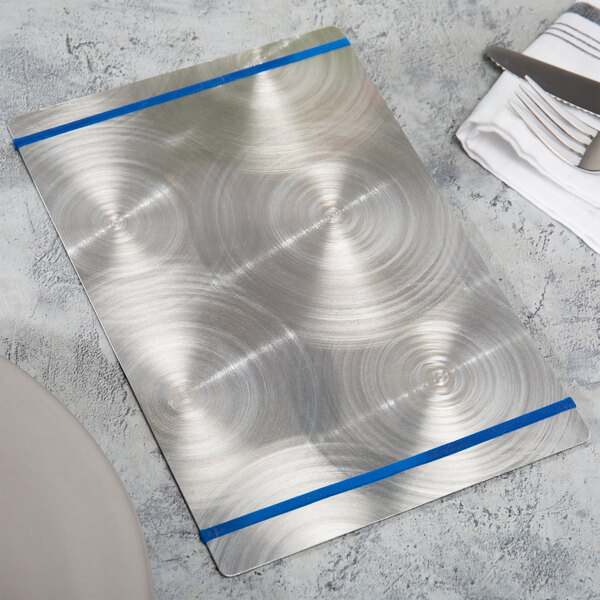 A Menu Solutions Alumitique menu board with navy blue bands on a white surface.