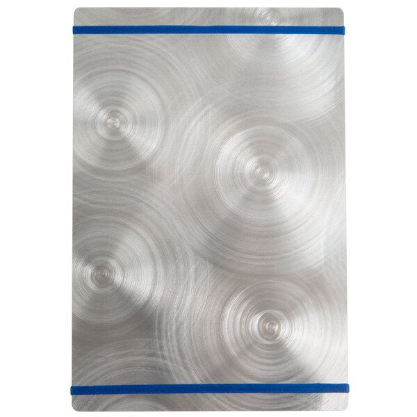 A silver rectangular Alumitique menu board with navy swirls on a metal surface.