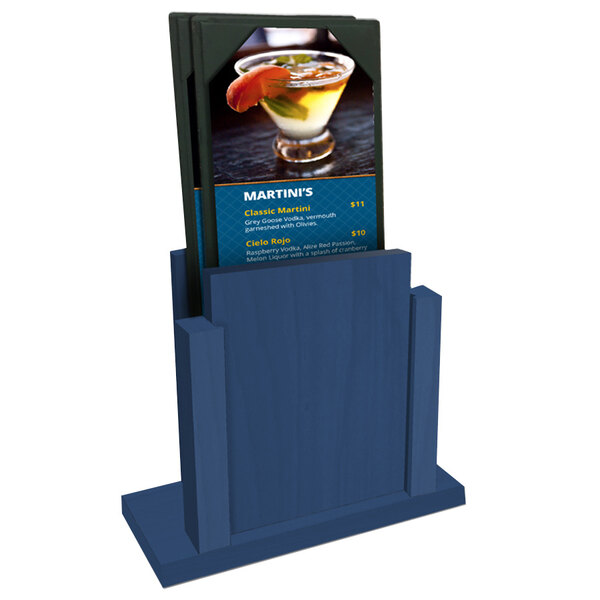 A Menu Solutions True Blue wood menu holder on a table with a menu in it.
