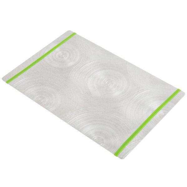 A white rectangular object with a swirly surface and green bands.