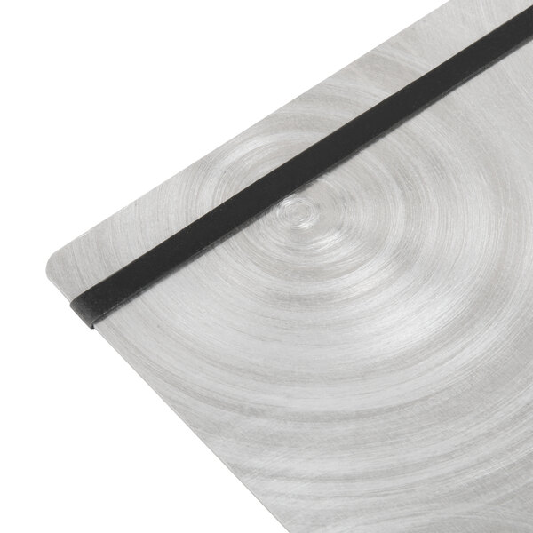 A Menu Solutions Alumitique aluminum menu board with black bands on a table.