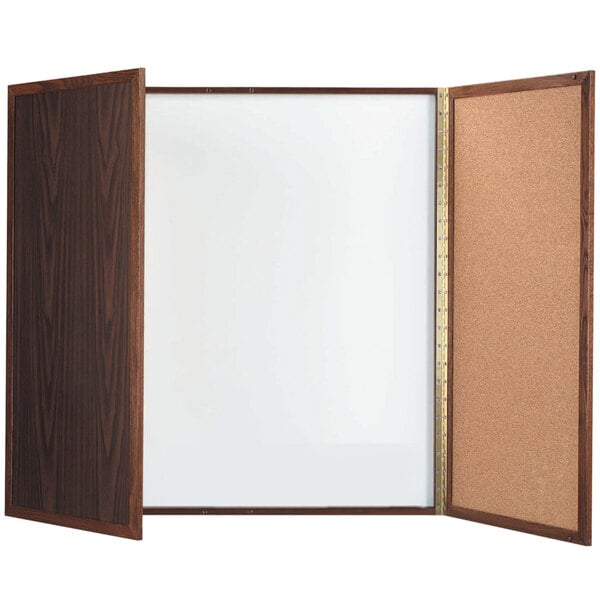 A wooden frame with a white board and cork board inside.