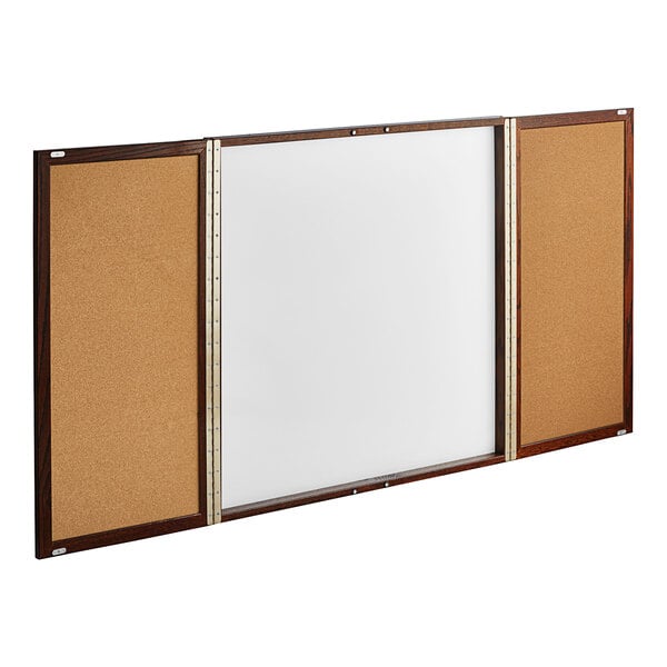 A white board with a wooden frame and cork board.